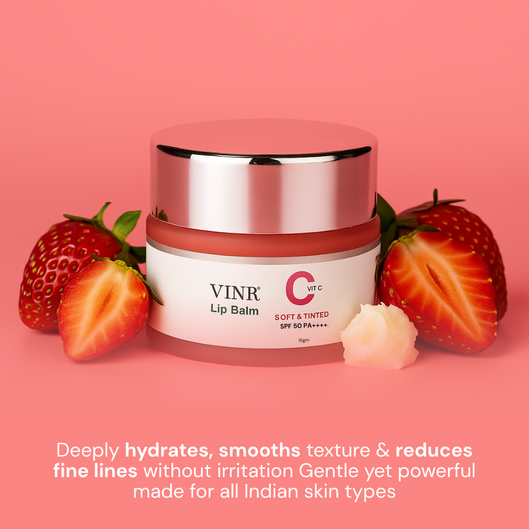 Pink lip balm jar with strawberries on a pink background