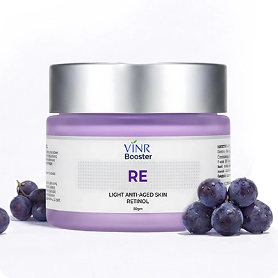 Jar of VINR Booster RE light anti-aging skin retinol with grapes on a white background